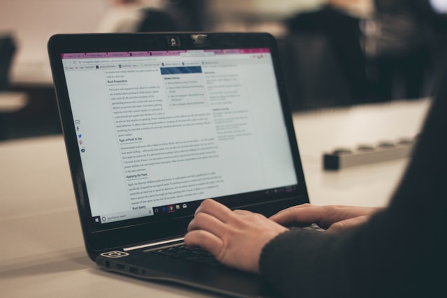 Powerful words on a laptop screen showing how professional copywriting services elevate brands through engaging, results-driven content